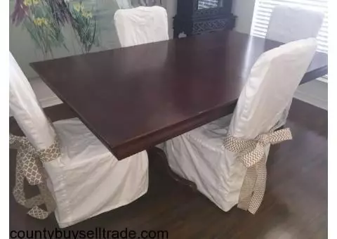 Dining table and 4 covered parsons chairs