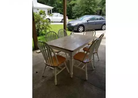 solid wood table and 6 chairs